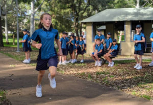 Student from St Aloysius Cronulla running cross country